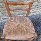 Antique straw chair with low back