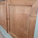 Buffet made of natural wood and bronze green.