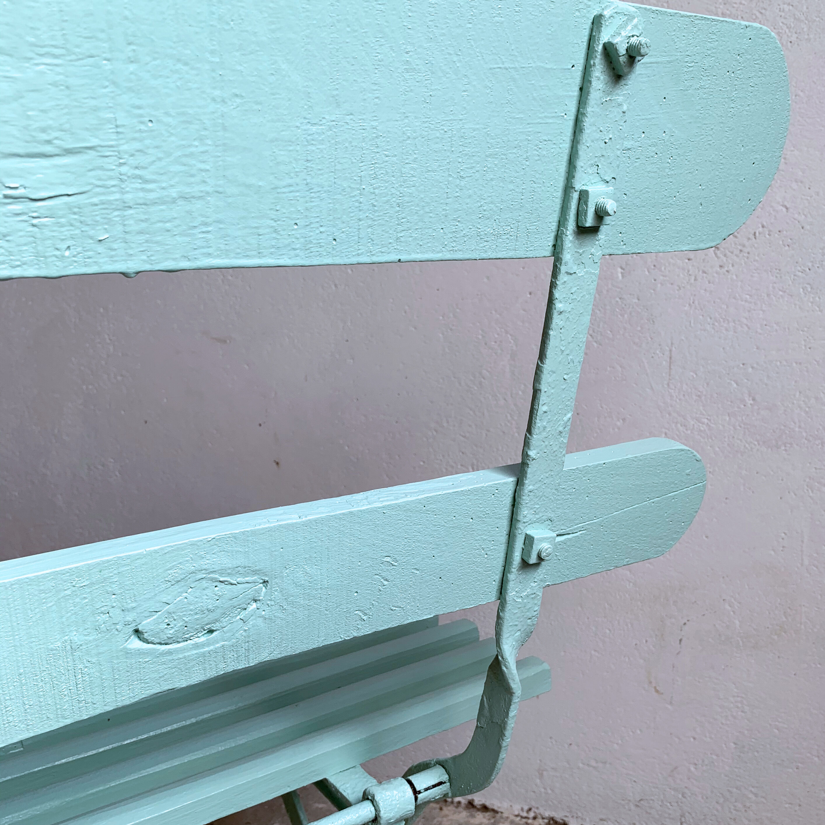 Former folding garden bench with wooden and metal slats