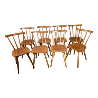 Lot de 8 chaises vintage en hêtre lasuré pieds compas et dossiers à barreaux