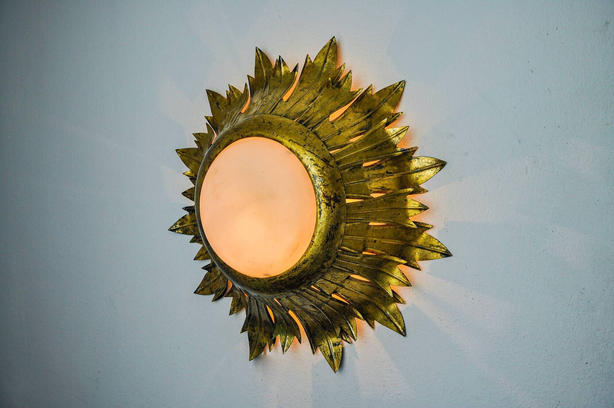 Sun wall lamp by ferro arte, metal and gold leaf, Spain, 1960
