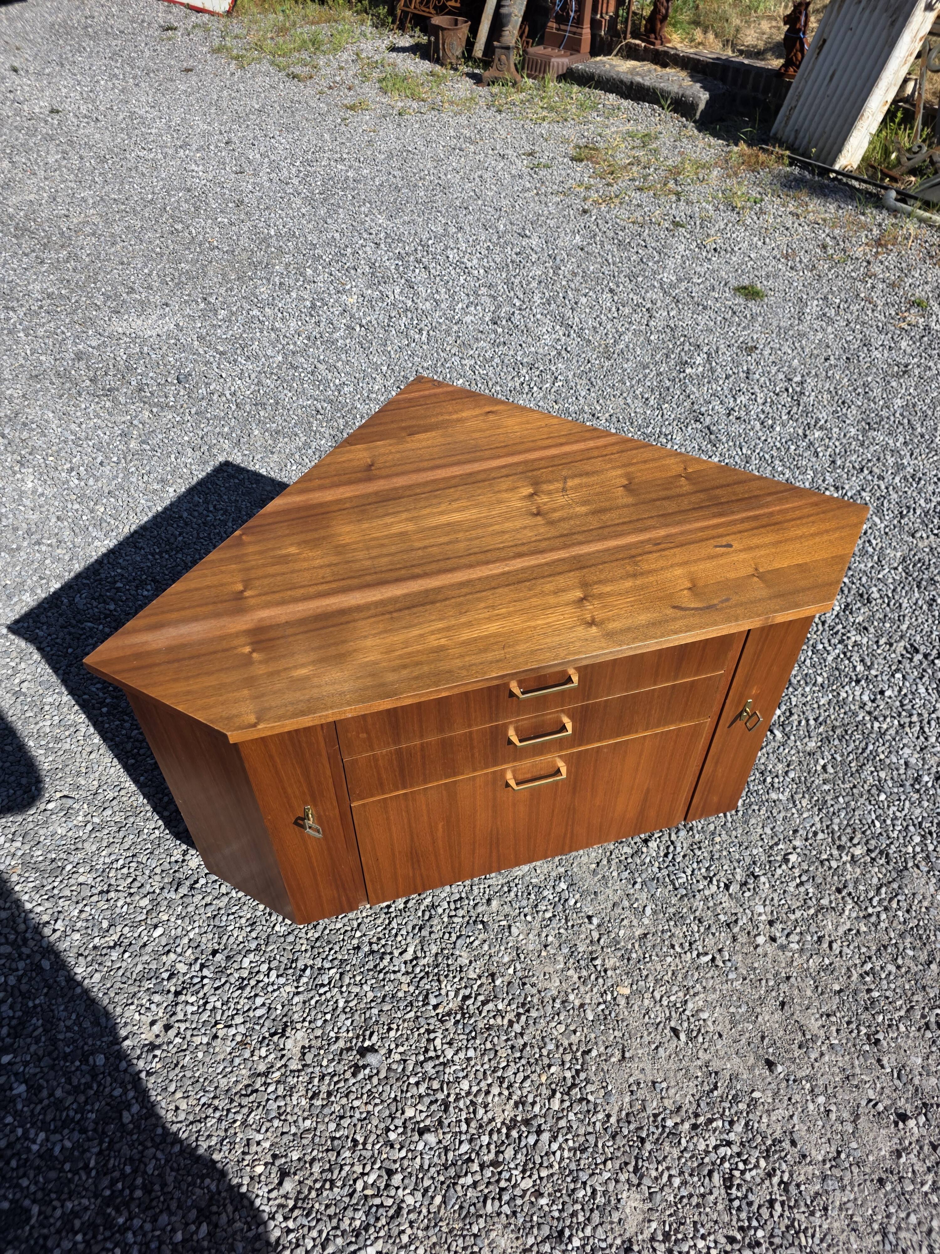 Scandinavian corner unit in teak from the 1960s.