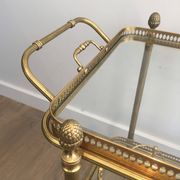 Neoclassical brass rolling table from Maison Baguès