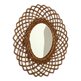 Sun mirror in woven rattan. 1960.