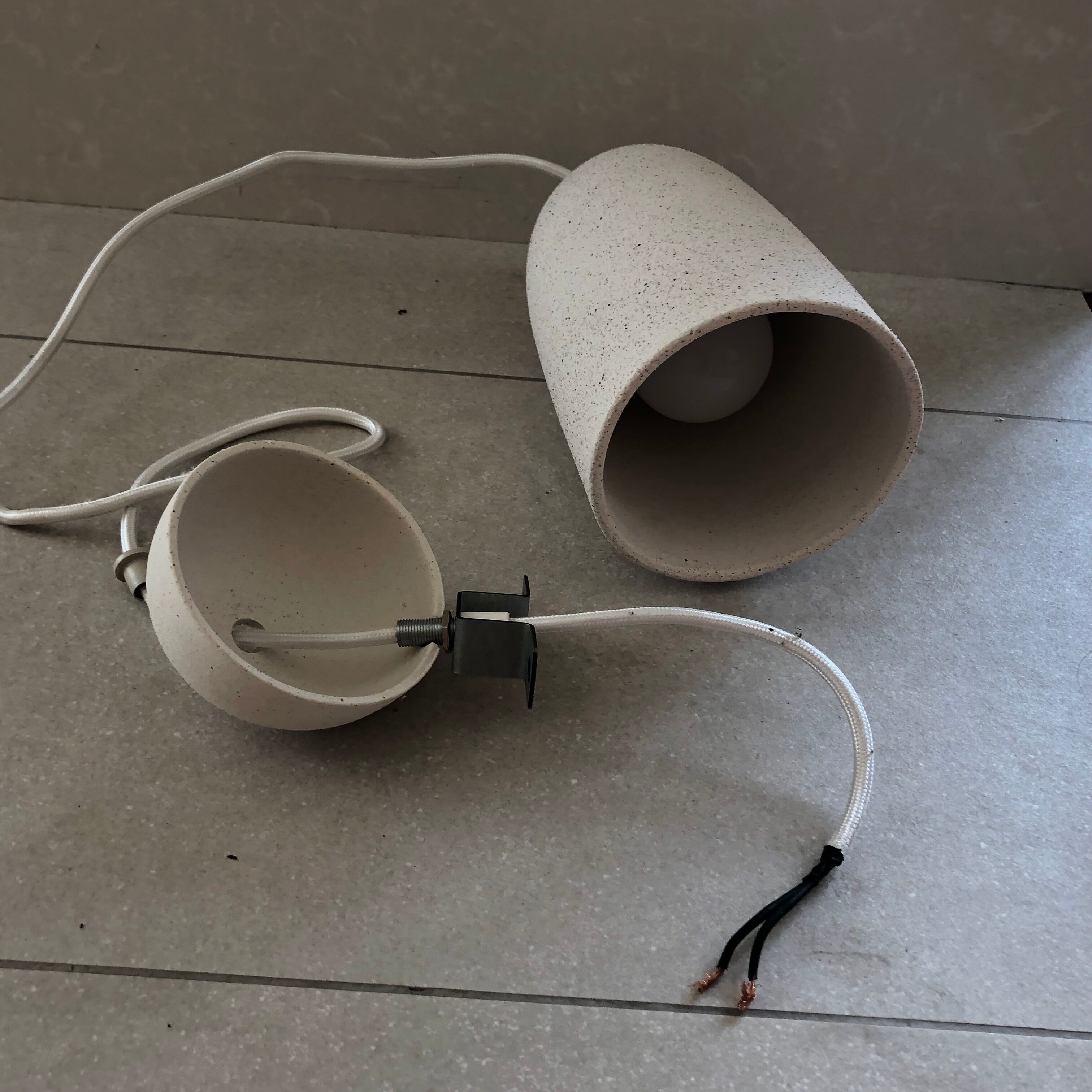 Speckled white ceramic suspended light fixture