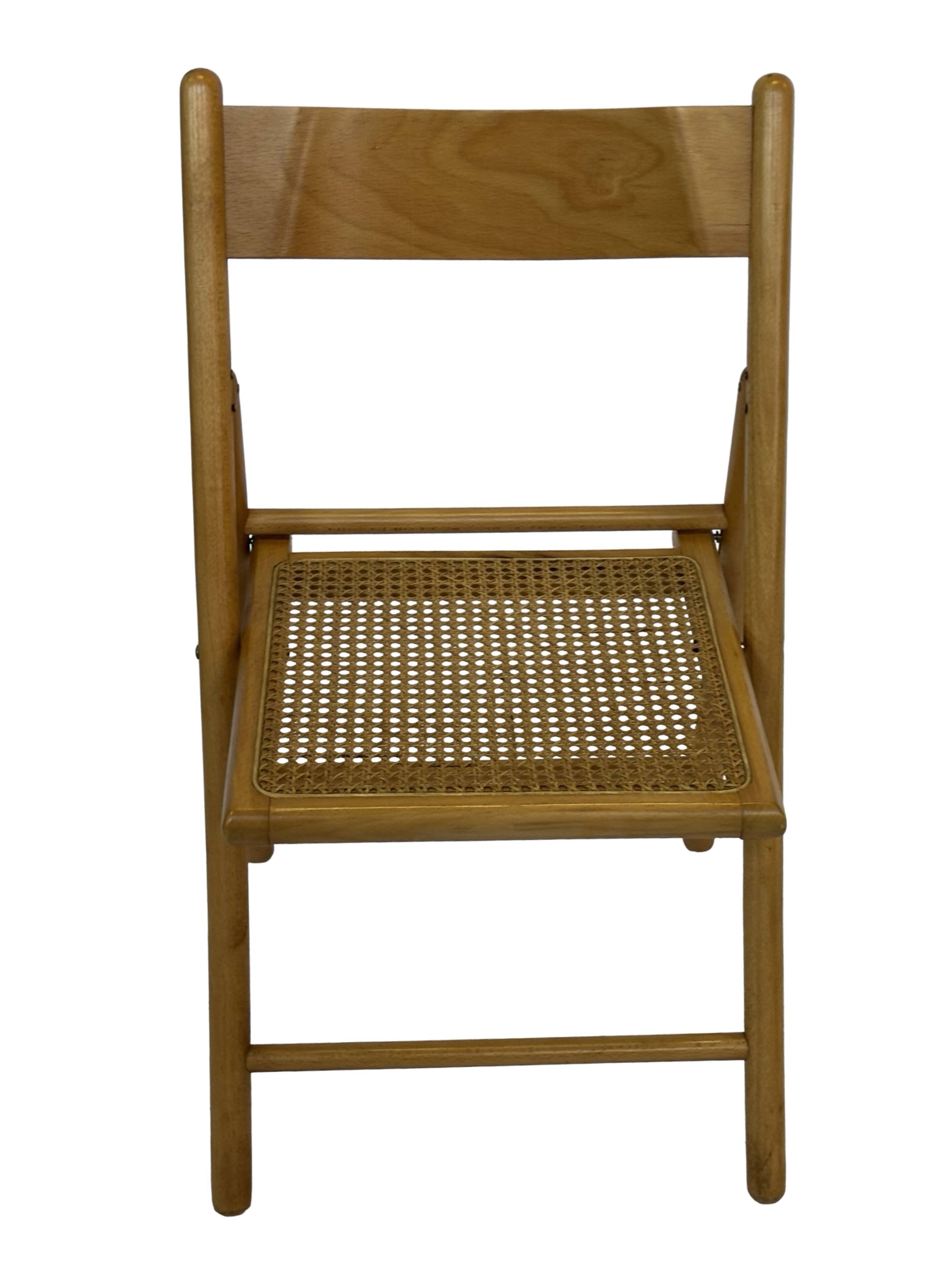 Vintage wooden folding chair with rattan seat 80s minimalist design