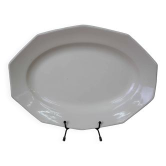 Plat ovale de forme octogonale en faïence blanche écru Moulin des Loups