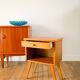 Scandinavian bedside table in teak veneer, with tapered legs and a drawer, 1960.