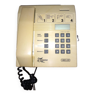 Business telephone with coin mechanism and key