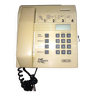Business telephone with coin mechanism and key