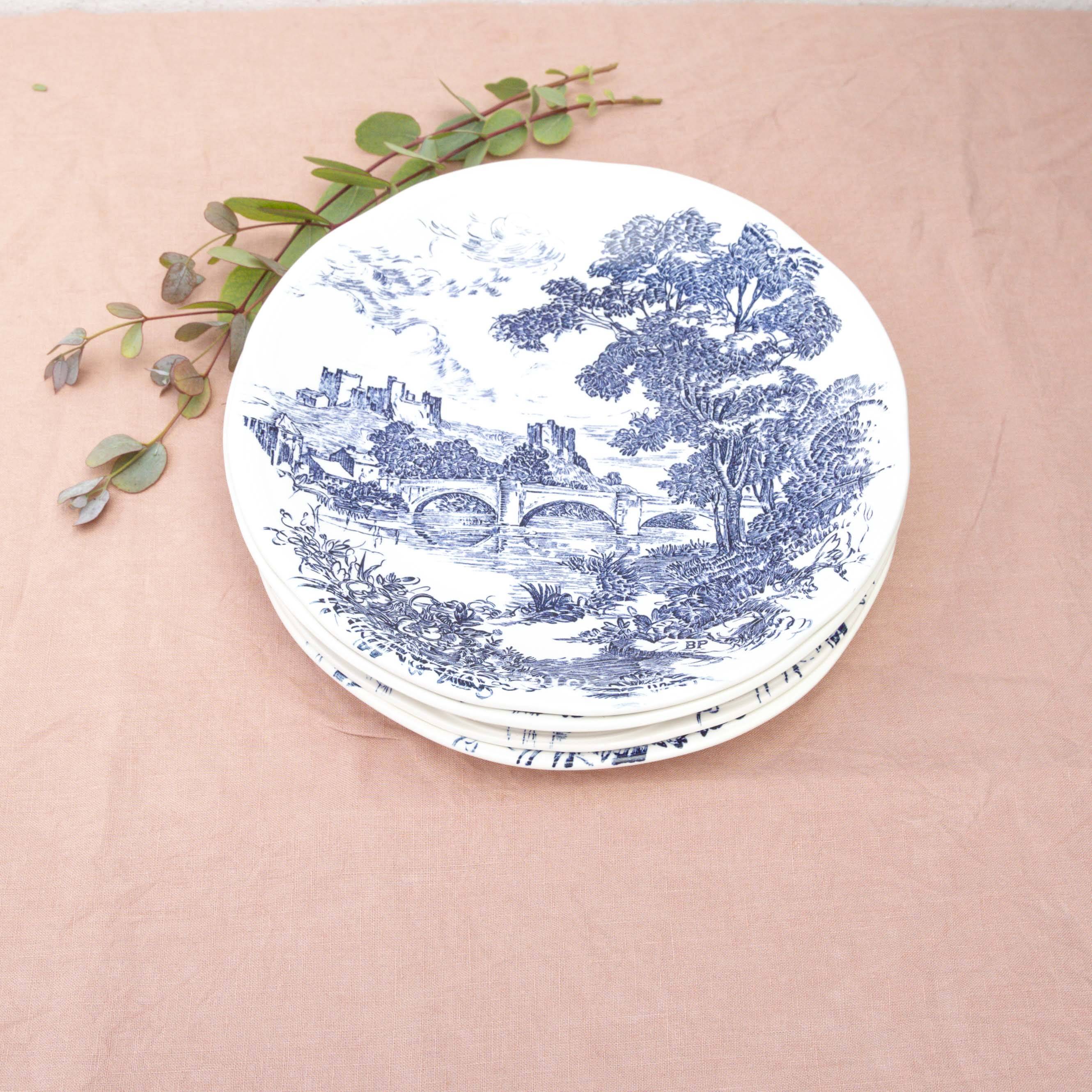 4 blue Gien plates with castle village bridge decor