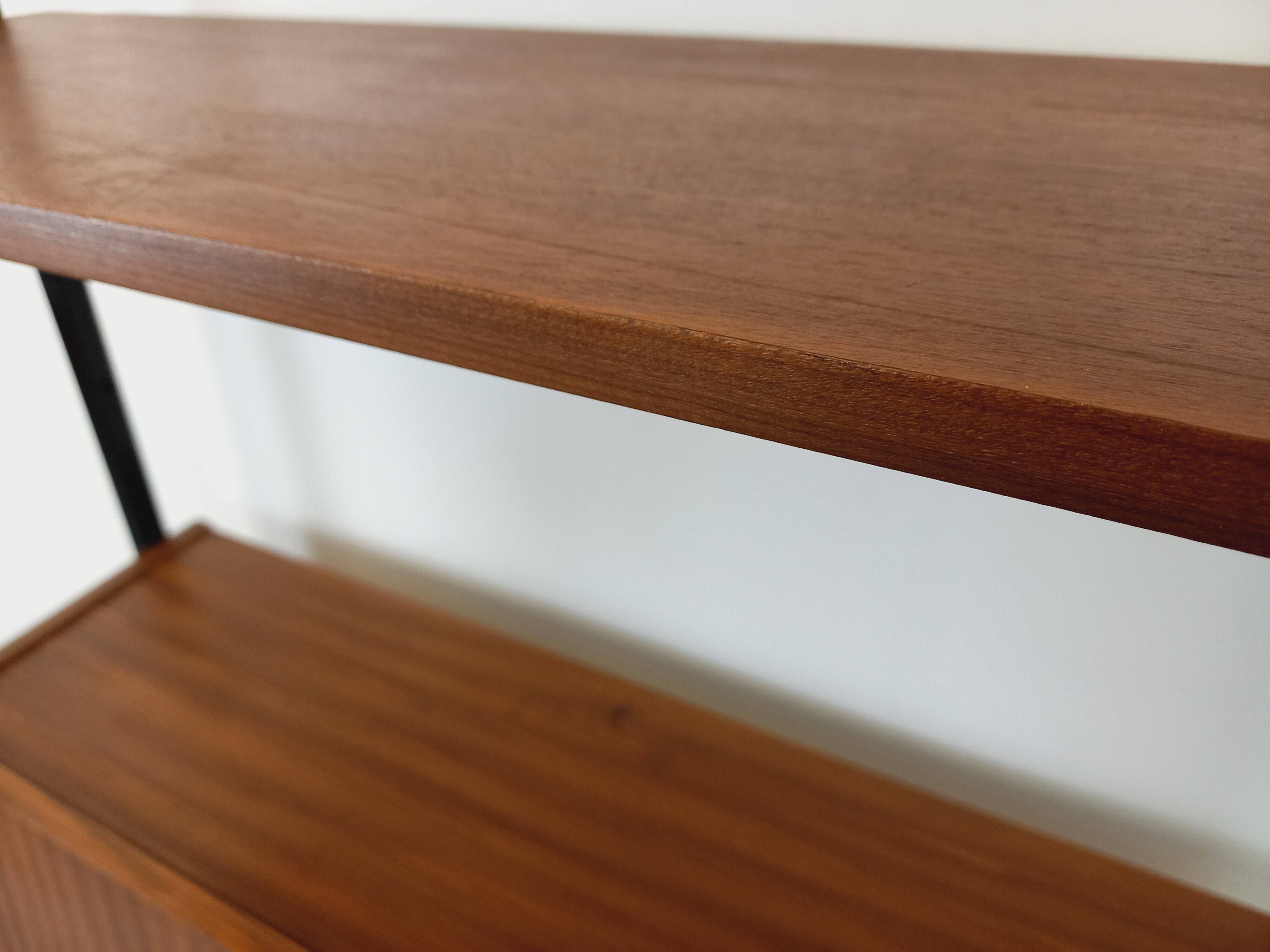 Vintage modular secretary bookshelf in teak and metal.