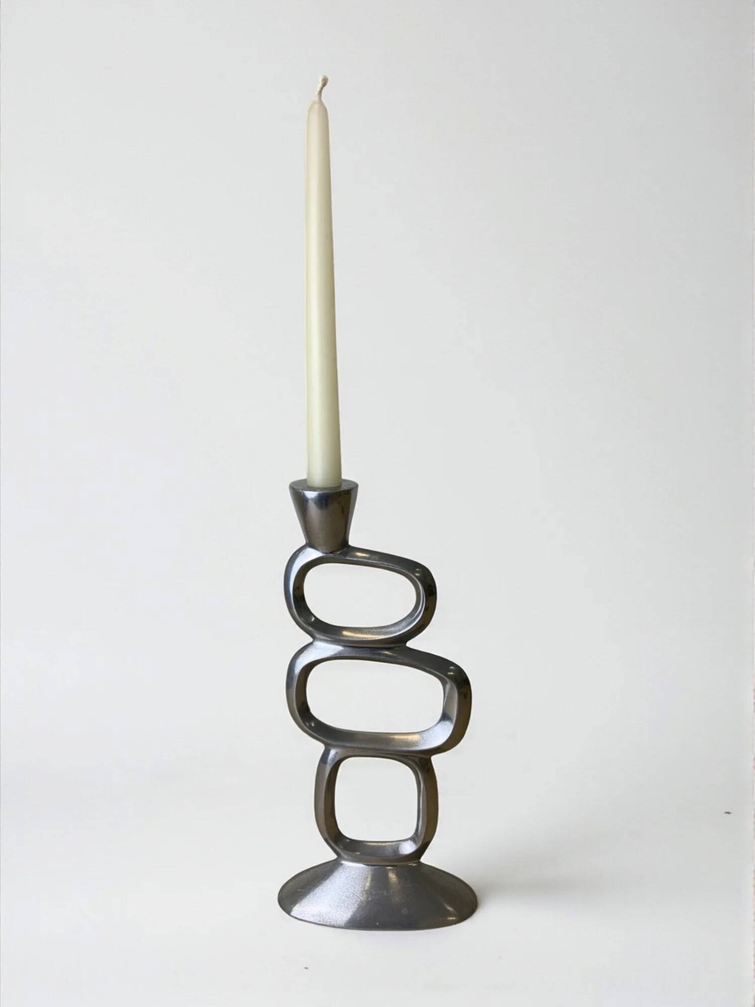 Circle candlestick by Matthew Hilton, solid aluminium, England, 1980s