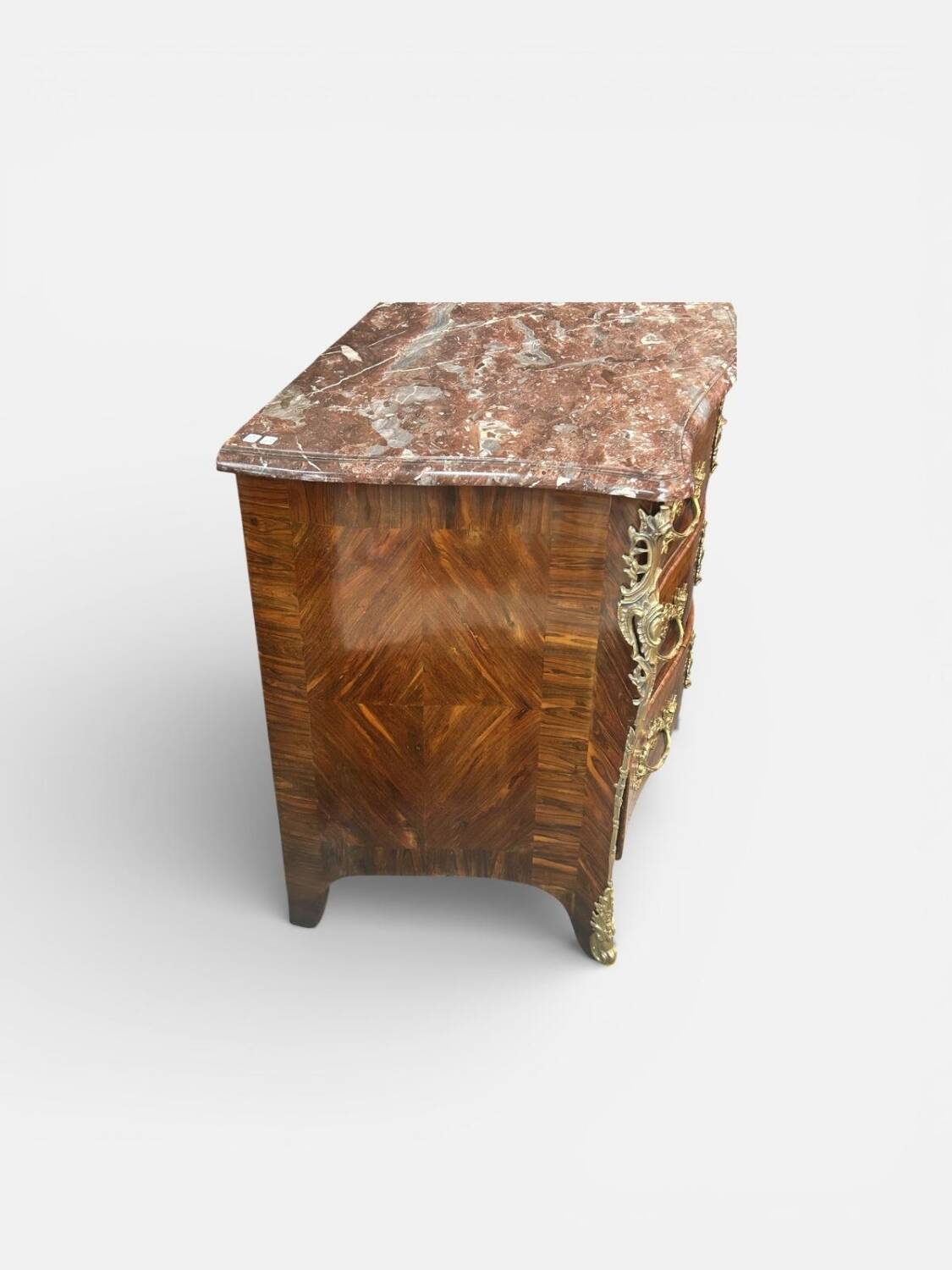 Louis XV period commode with violet wood veneer.