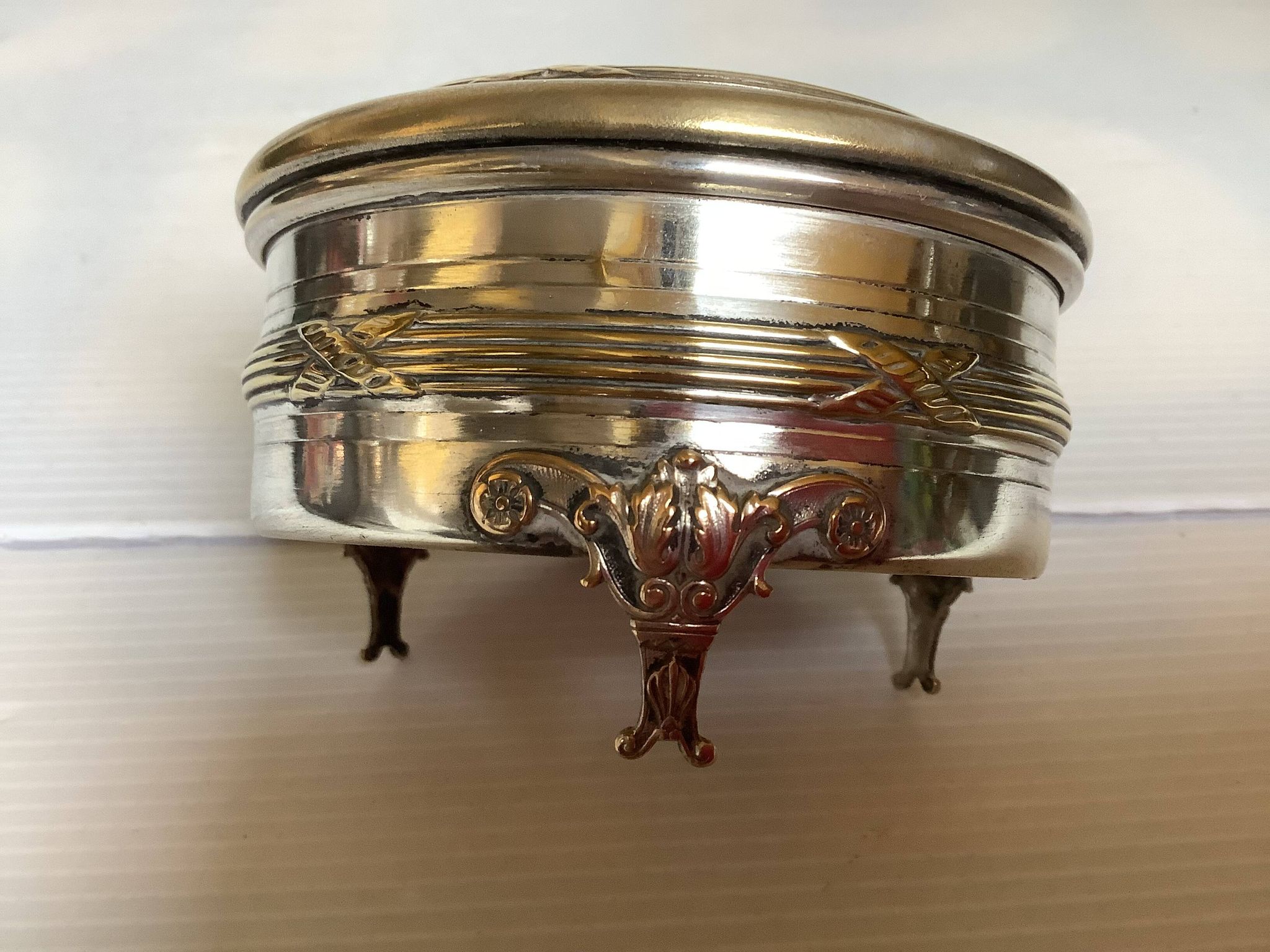 Antique silver-plated tripod box in the Louis XVI style.
