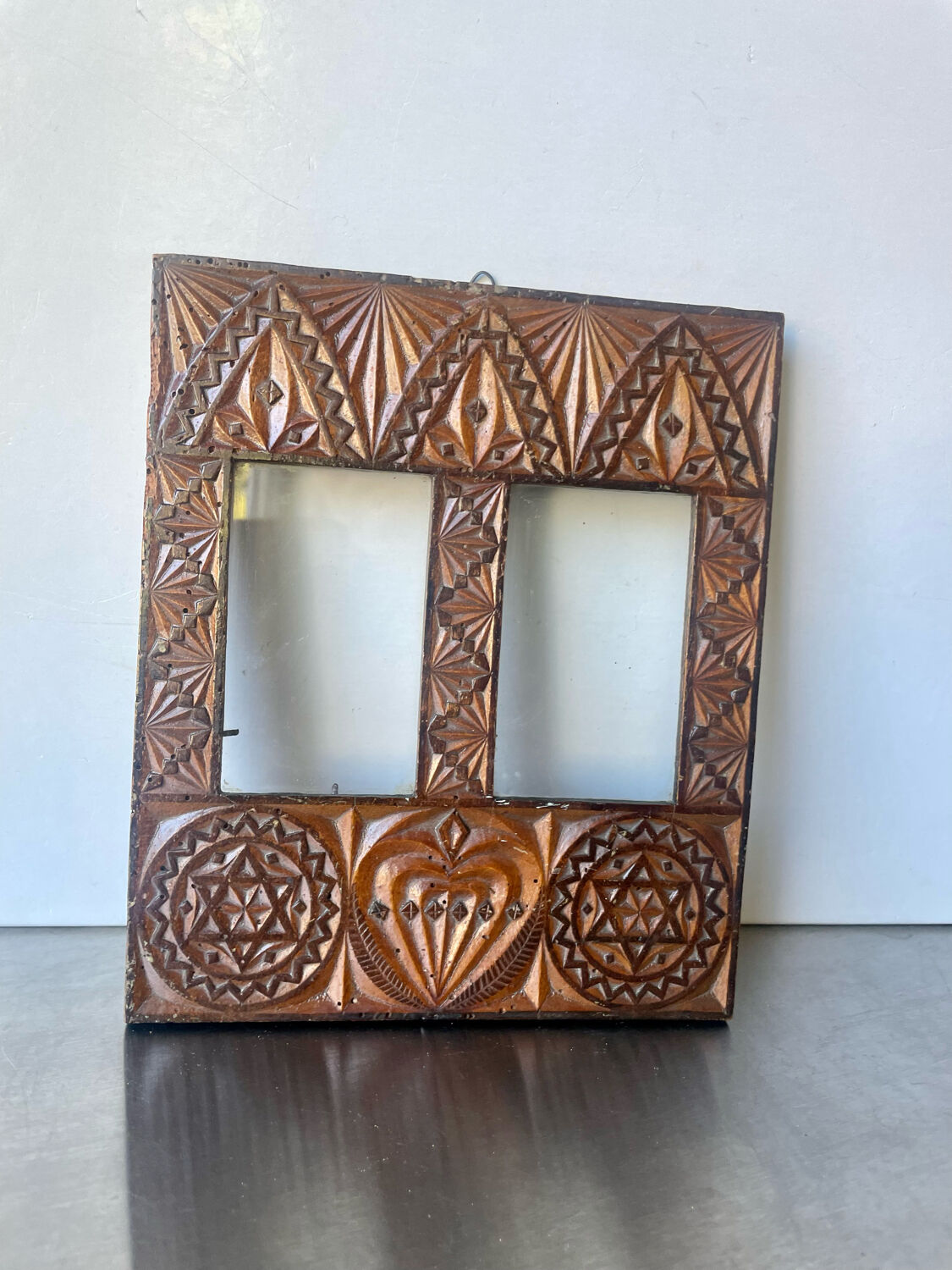Double frame intricately carved wood
