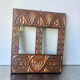 Double frame intricately carved wood