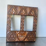 Double frame intricately carved wood