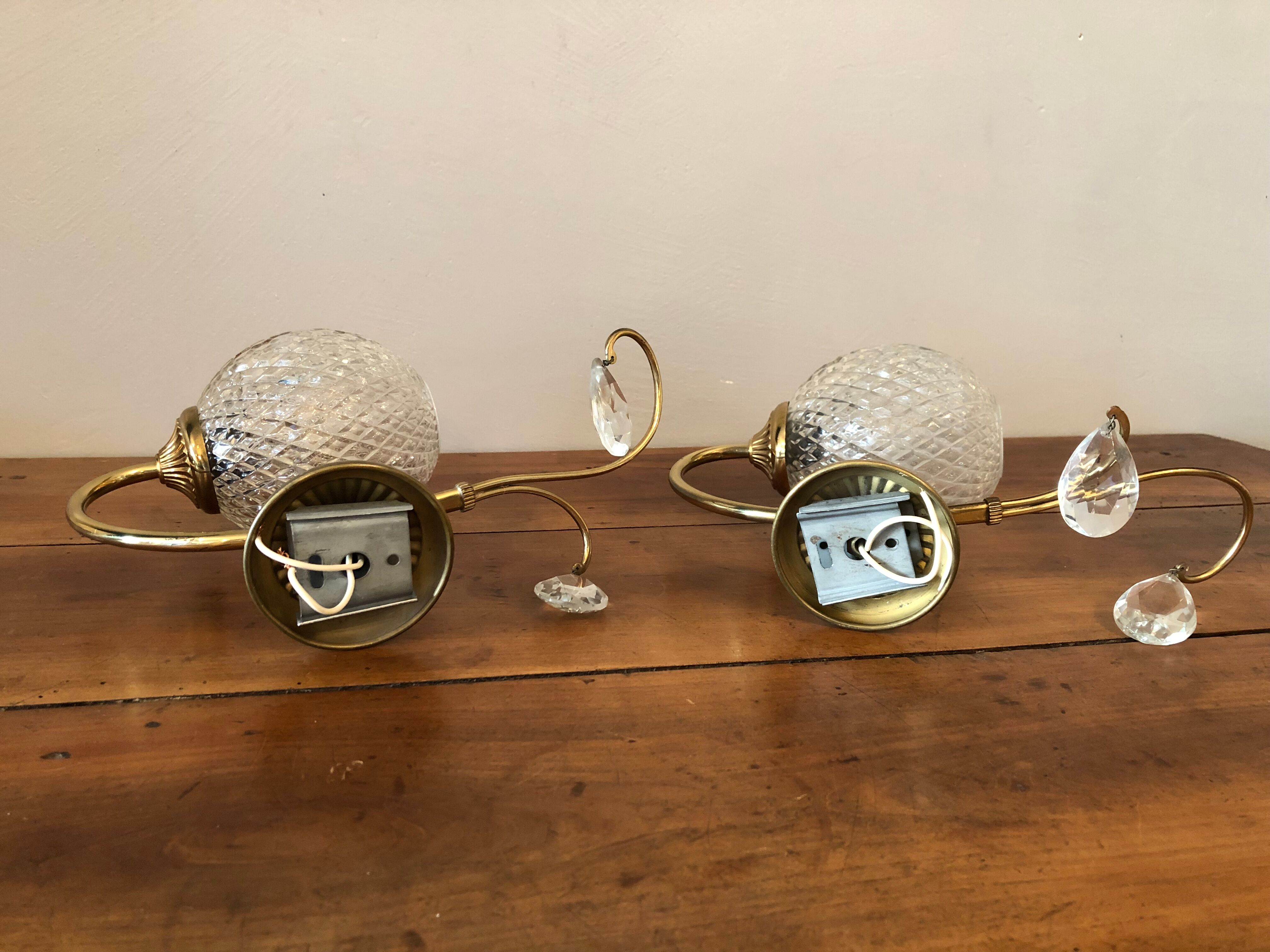Duo of brass and glass wall lamps