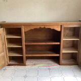 Upper part of a rustic solid oak dresser with its cornice.