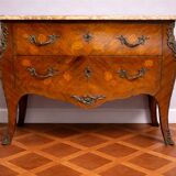 Curved Louis XV style commode with floral marquetry and marble top.