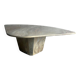 Light gray solid granite coffee table with organic triangular shape and conical base, 1980s