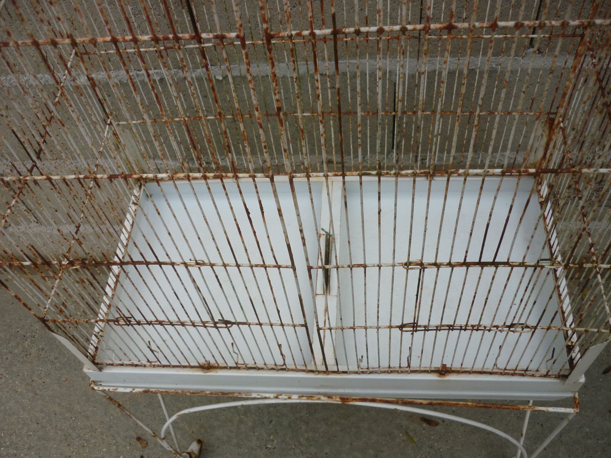 Bird cage with its wheeled holder