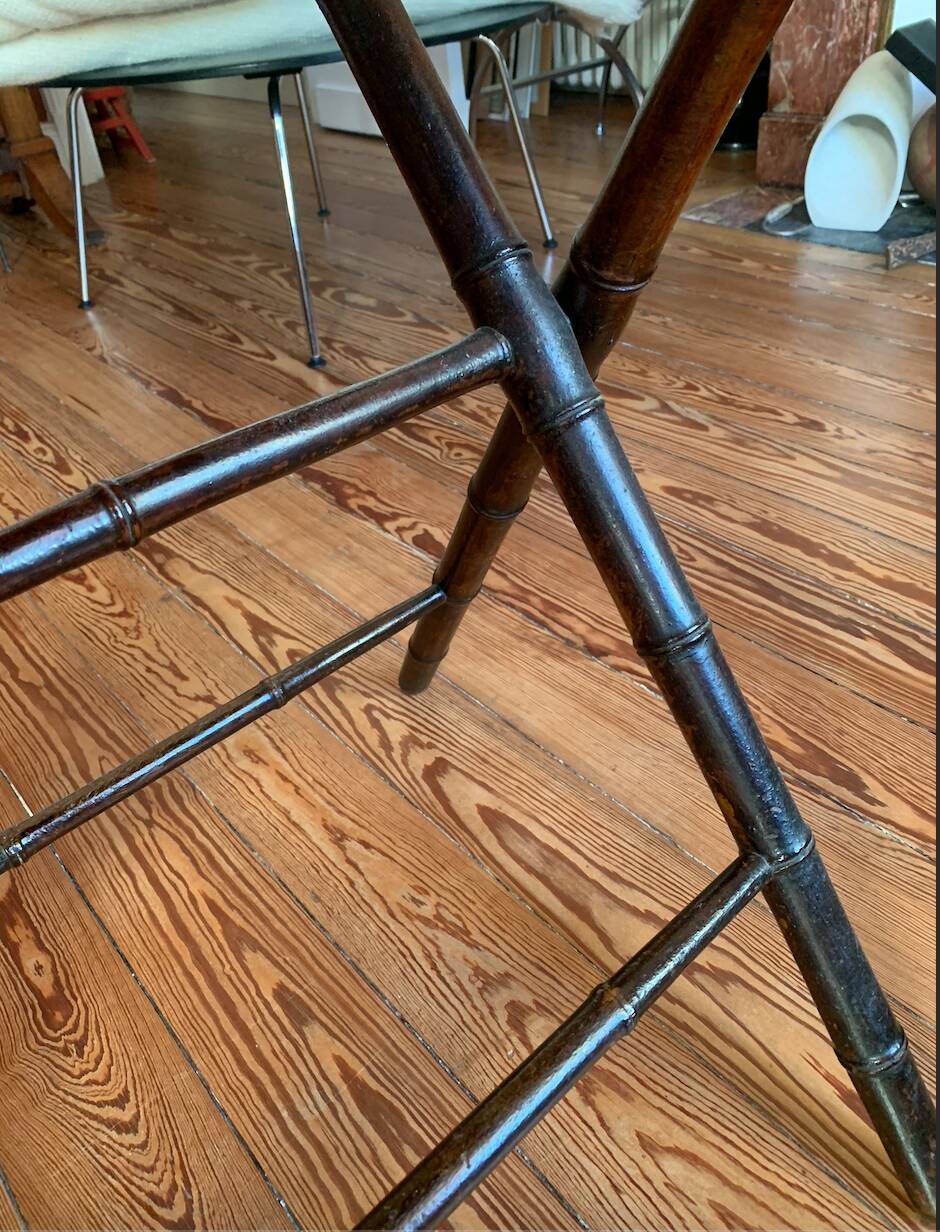 Folding mahogany table with a mirror top.