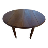 Antique round table with shutters in walnut wood on casters