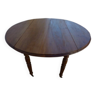 Table ronde ancienne à volets en bois noyer à roulettes