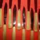 Set of 12 table knives and 12 cheese knives in bone and stainless steel.