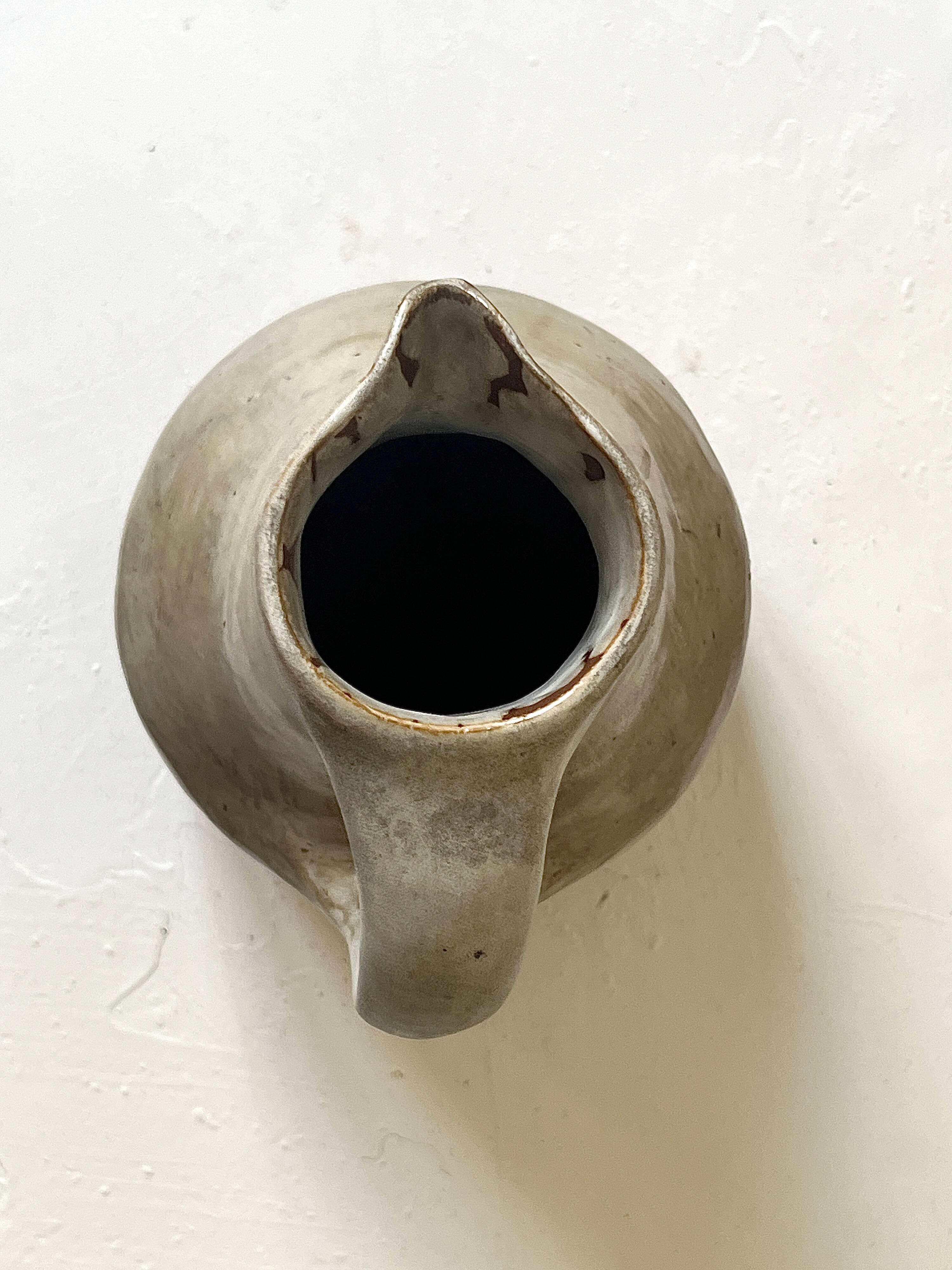 Large brutalist ceramic enamelled jug, signed "MH".