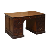 Double-sided partner desk with two Gillows Lancaster cabinets in mottled oak.
