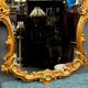 Golden mirror. Wood.