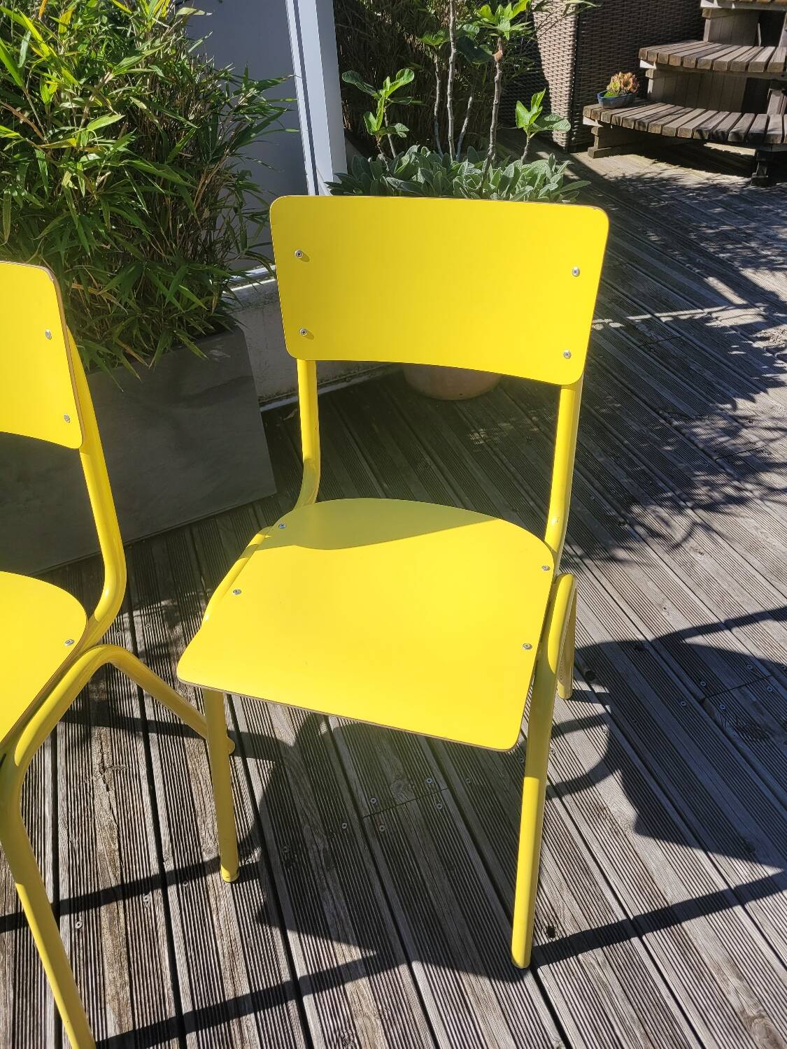 Pair of yellow plywood chairs