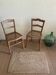 Set of two antique chairs with caning.