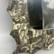 Free-form mirror decorated with cherubs.