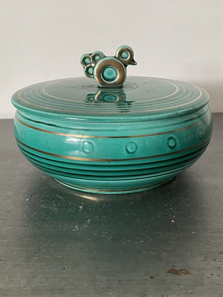 Green cermal pot decorated with bird