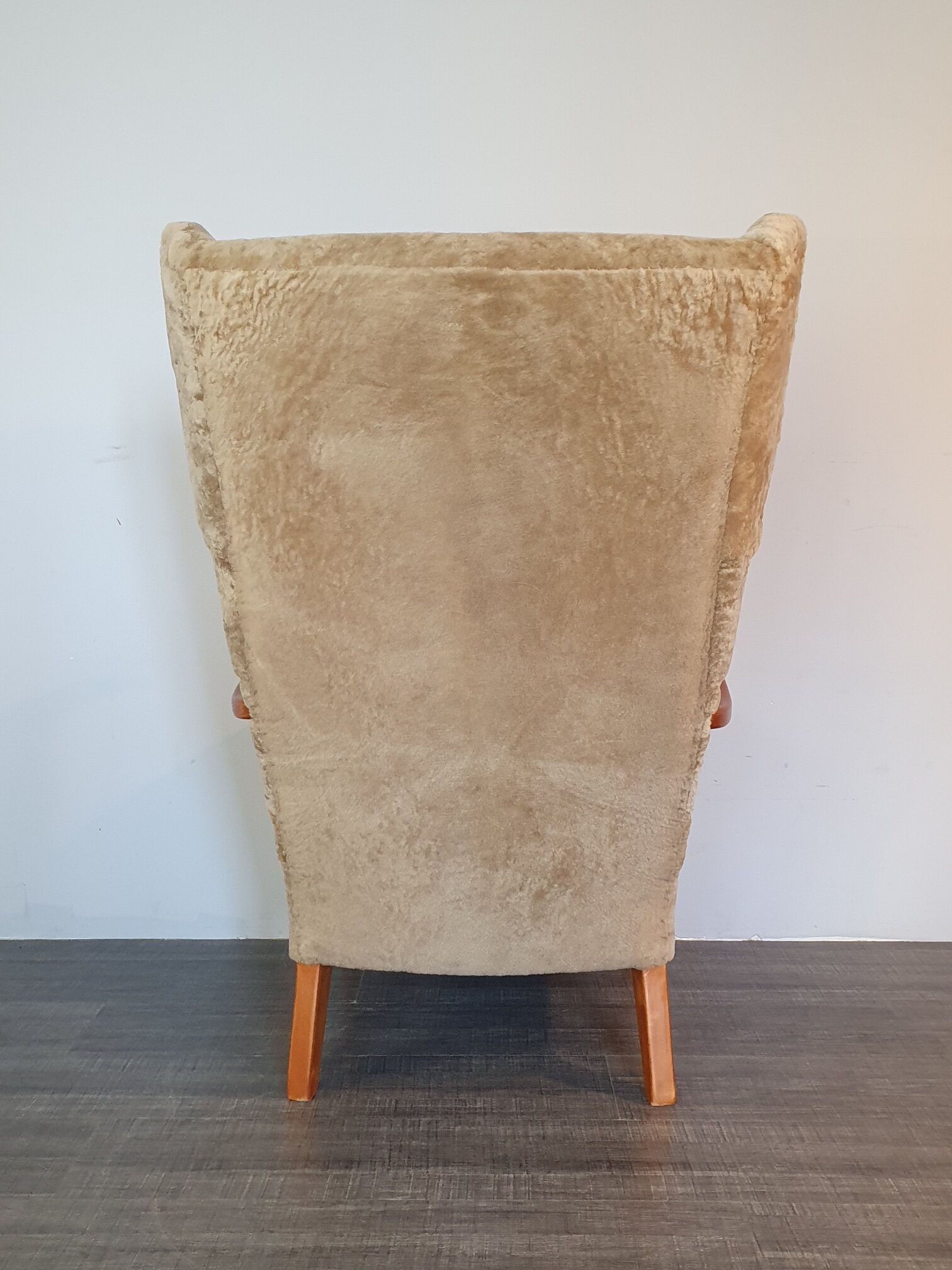 Norwegian sheepskin wing armchair with ottoman 1950