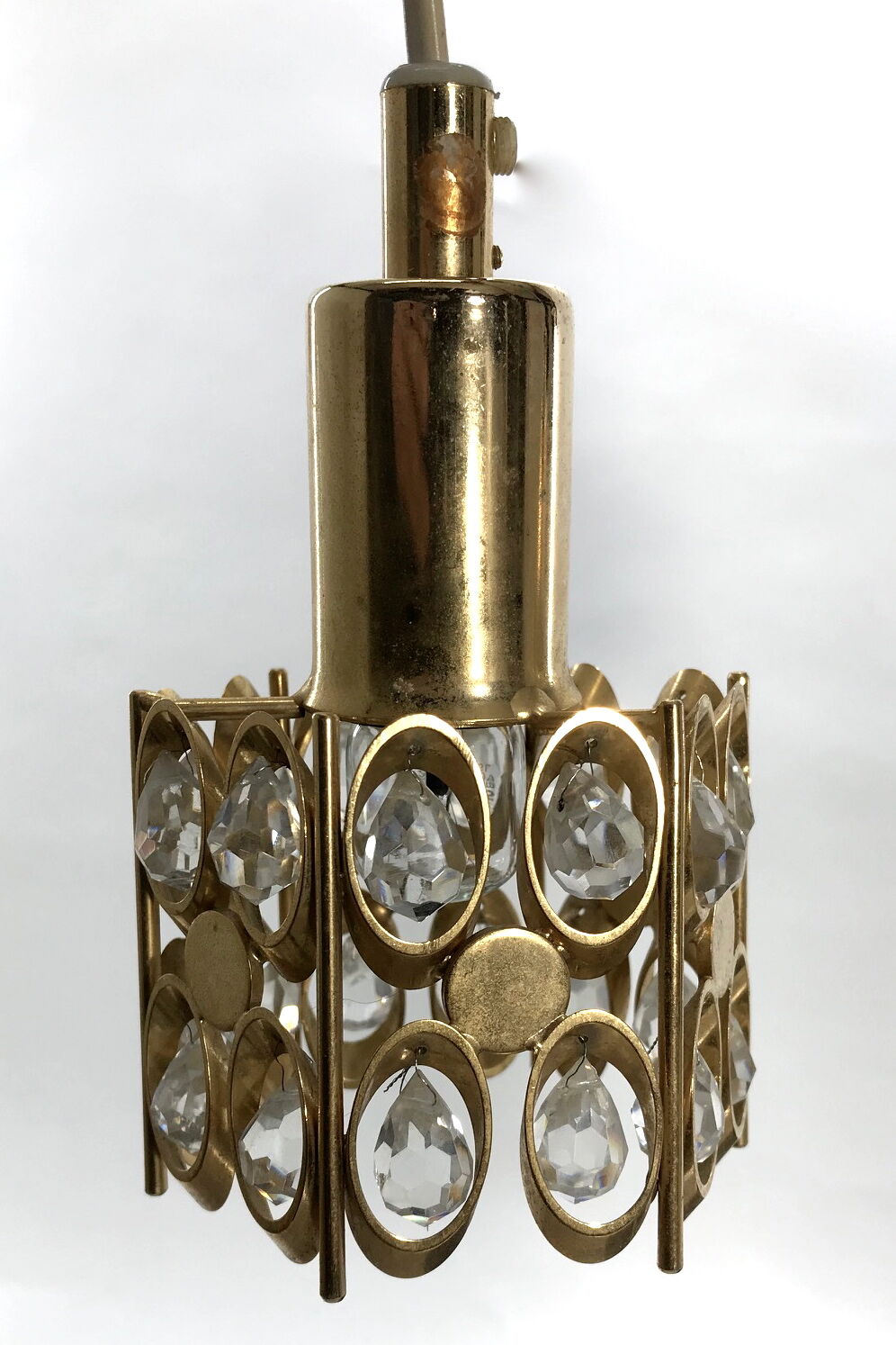 Two pendant lights in gilded brass and crystal, by Palwa, design 1960