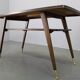 Mid-century German coffee table with rattan shelf and brass legs