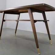 Mid-century German coffee table with rattan shelf and brass legs