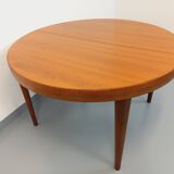 Large vintage Scandinavian round table from the 50s 60s in teak with extensions