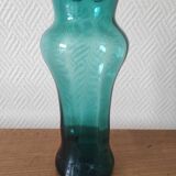 Blown glass vase with a flared neck and wavy rim.