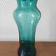 Blown glass vase with a flared neck and wavy rim.