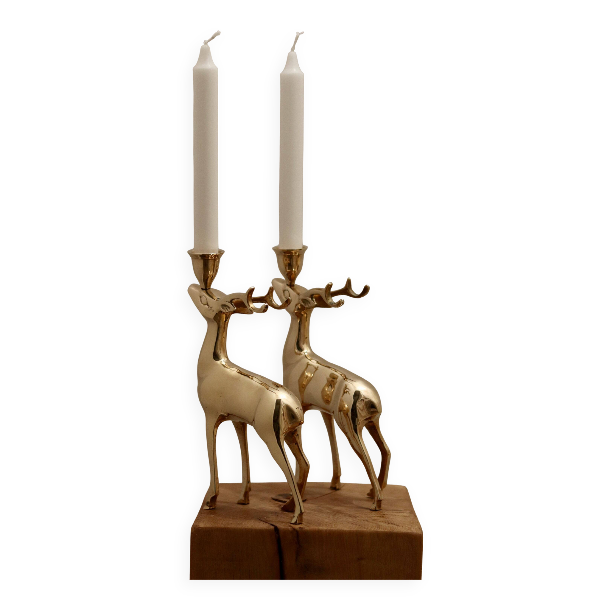 Pair of brass candle holders in the shape of deer from the mid-century.