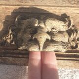 Carved wooden pediment with bunches of grapes