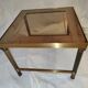 Small table or side table with brass structure and glass top from the 1970s.