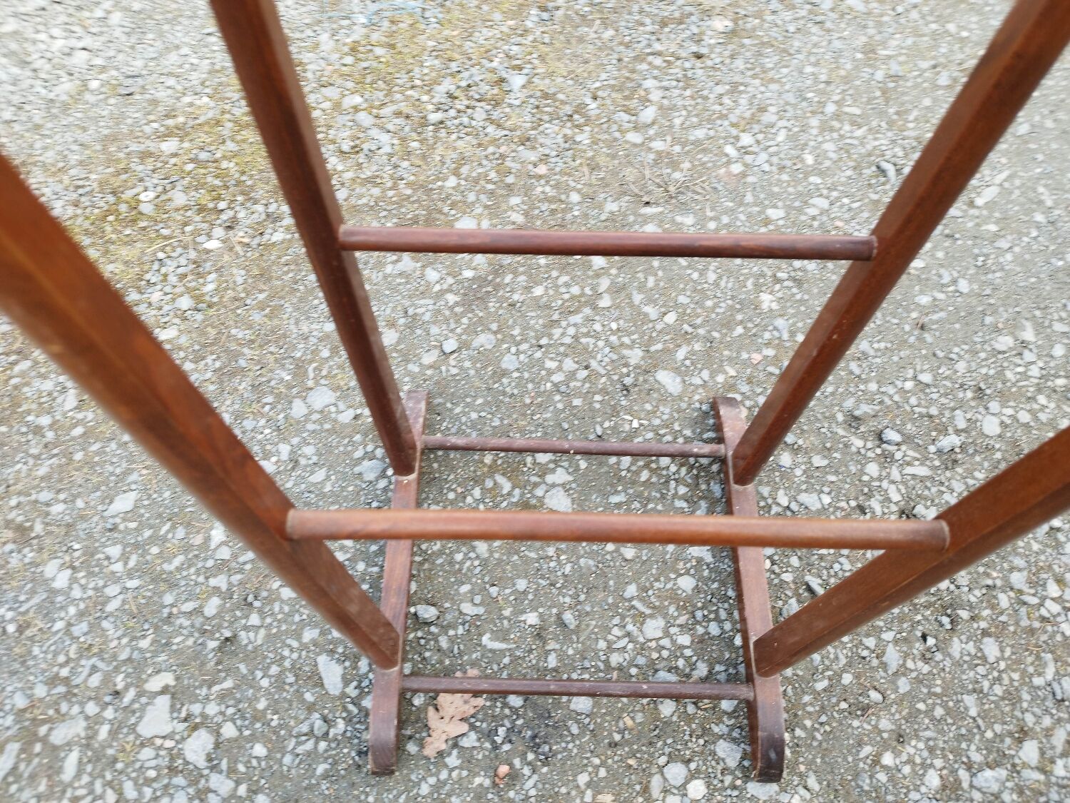 Valet wearing double wood coat rack