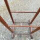 Valet wearing double wood coat rack